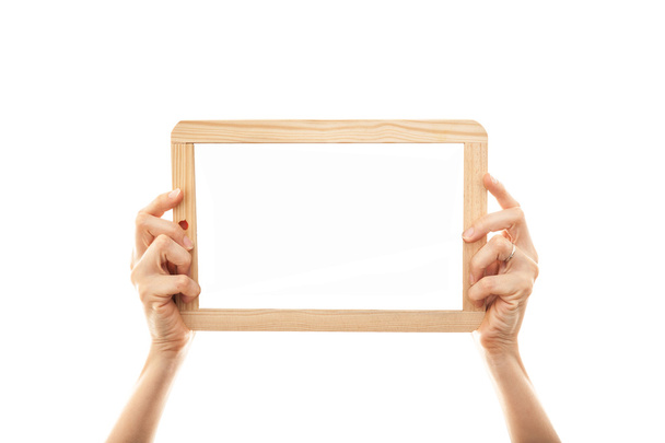 Hands holding a frame - Foto, afbeelding