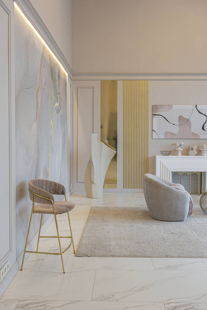 the latest fashion home trends in an ultra modern elegant interior of a cozy studio in soft pastel colors. close-ups of a stylish living area with golden elements - Фото, зображення