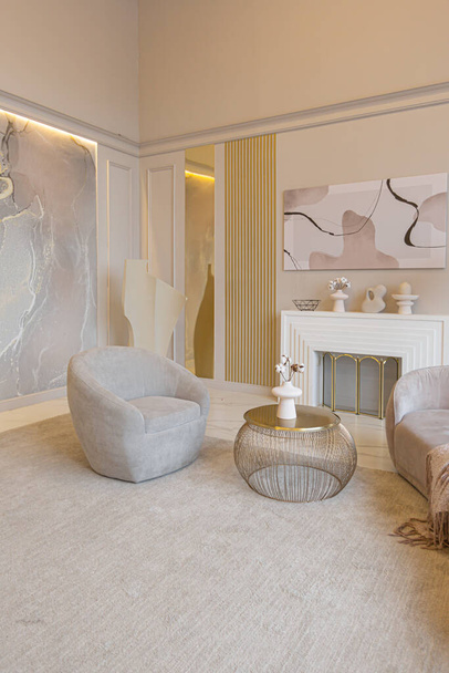 the latest fashion home trends in an ultra modern elegant interior of a cozy studio in soft pastel colors. close-ups of a stylish living area with golden elements - 写真・画像