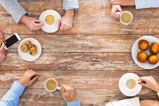 close up of business team drinking coffee on lunch - Photo, image