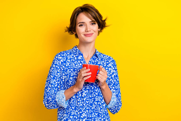 Photo of lovely pretty lady wear blue clothes enjoy fresh cappuccino isolated on yellow color background. - Foto, Imagen
