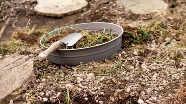 Garden landscaping with soil sieve and spade low wide zoom shot selective focus - Footage, Video