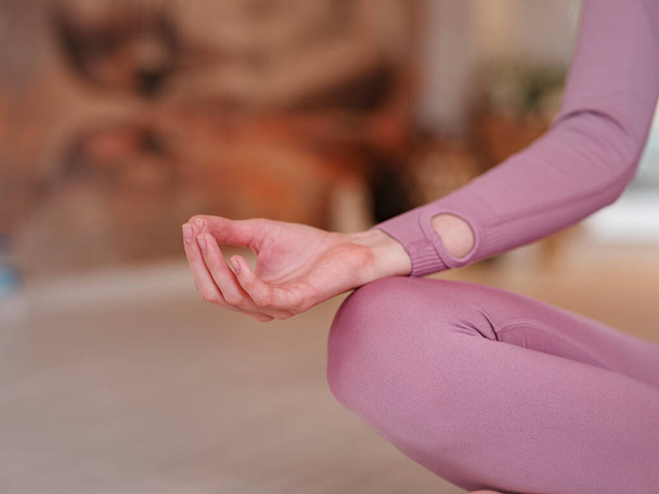 workshop of air yoga and stretching in yoga studio. woman meditating in lotus pose yoga fitness hall - Foto, Bild