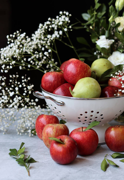 Still life with beautiful red apples on a table. Juicy summer fruit close up photo. Eating fresh concept.  - 写真・画像