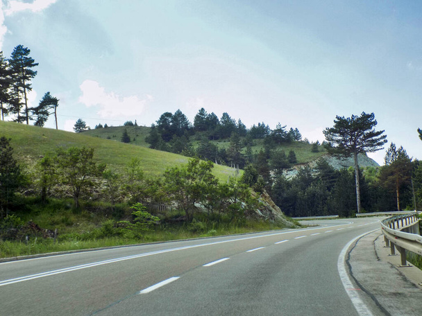 Road winds through the mountains - 写真・画像