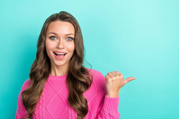 Portrait of astonished pretty lady wear stylish pink clothes opening boutique low prices empty space isolated on cyan color background. - Fotó, kép