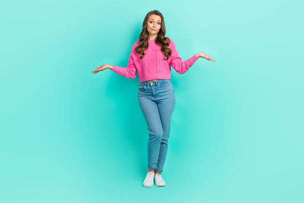 Full length photo of doubtful unsure lady dressed knitted pullover shrugging shoulders isolated teal color background. - Photo, image