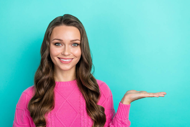 Portrait of adorable gorgeous lovely lady wear trendy pink clothes arm presenting spa salon empty space isolated on cyan color background. - Φωτογραφία, εικόνα