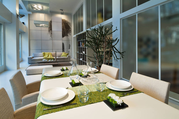 Table set in a modern setting with runner - Foto, immagini