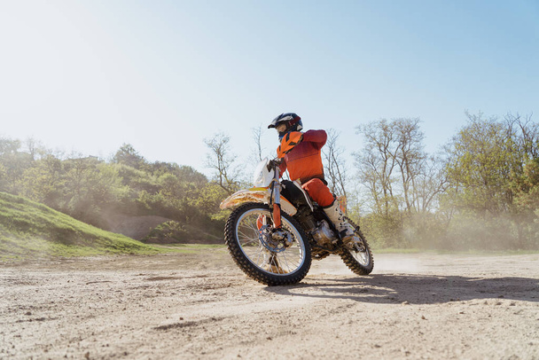 Man riding motorbike on motocross track.Extreme and Adrenaline. Motocross rider in action. Motocross sport. Active lifestyle - Valokuva, kuva