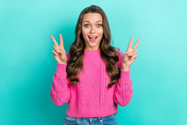 Photo of fancy pretty impressed woman with wavy hairdo dressed knitwear sweater showing v-sign greetings isolated on teal color background. - Photo, Image