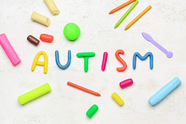 Word AUTISM with plasticine on white background - Foto, afbeelding