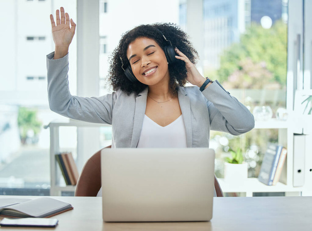 Happy woman, dance and music headphones on office laptop for fun, energy and corporate freedom. Smile, employee and dancing worker listening to audio, podcast or headset radio on business technology. - Photo, Image