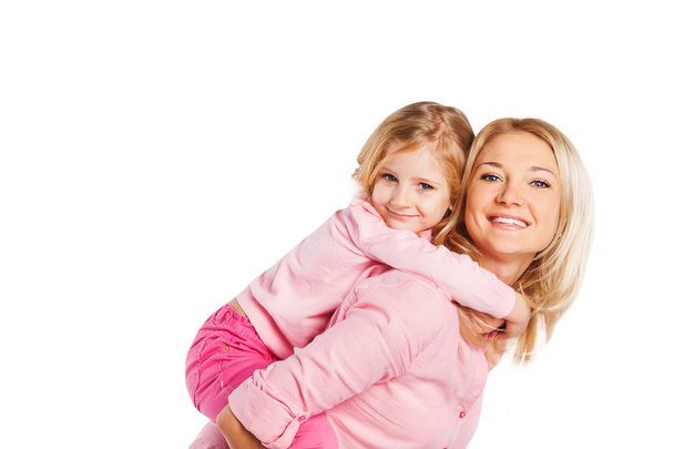 Closeup portrait of happy mother and daughter - isolated. Happy family people concept. - Foto, afbeelding