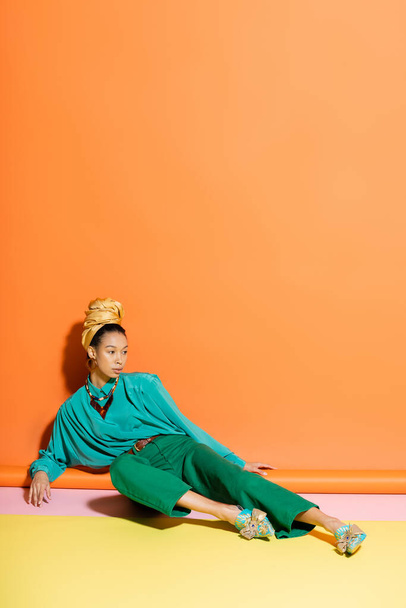 Fashionable african american model in summer clothes posing on colorful background  - Foto, immagini