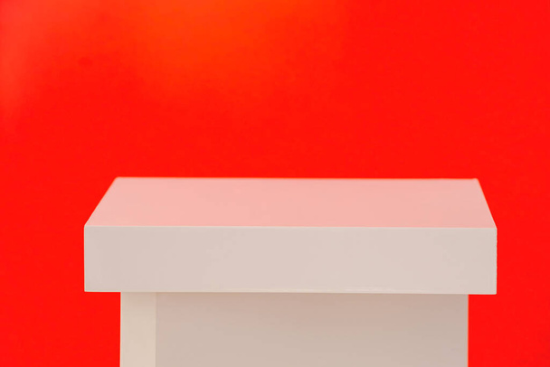 Product display background. White Square Box Podium Studio Stage On Red Background.  - Photo, image