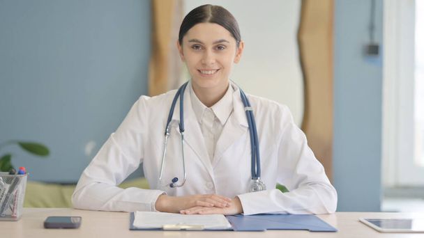 Smiling Young Female Doctor Looking at Camera in Clinic - Photo, Image