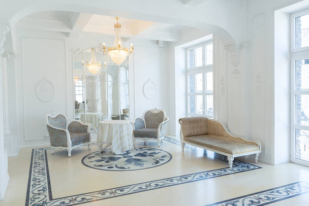 beautiful stylish chic rich clean bright blank interior. high white walls with large windows from floor the pattern on the floor - Fotografie, Obrázek