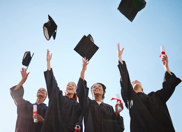 Graduation, students and education goal success celebration with happy women excited victory hat throw. University, motivation and friends graduate together, united achievement for young learners. - 写真・画像