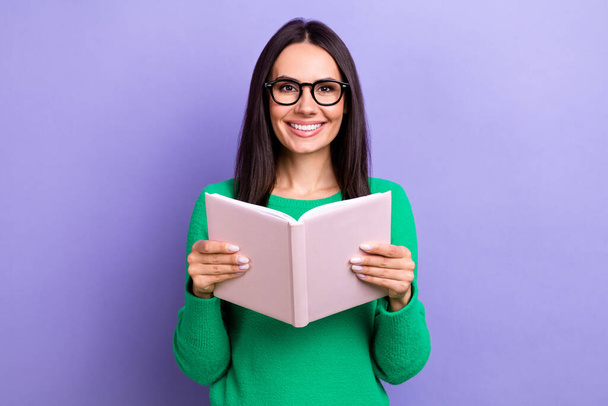 Photo of cheerful positive woman wear green pullover spectacles enjoying good book isolated purple color background. - Photo, image