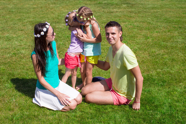 Happy family with two children outdoors on summer day - Foto, Bild