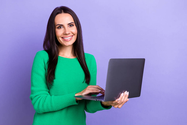 Photo of young successful it company developer lady hold her new hp laptop online corporate meeting remote isolated on purple color background. - Foto, Imagem
