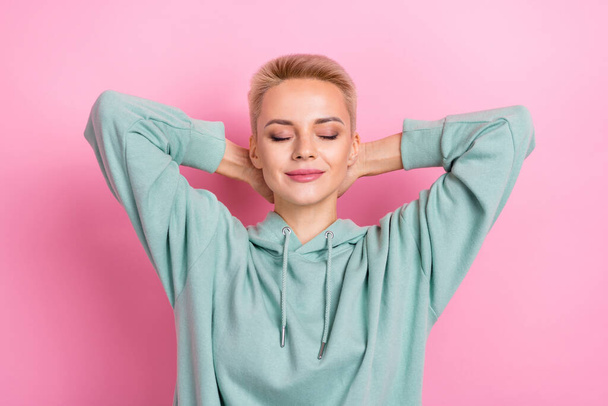 Photo of young satisfied cheerful dreamy cute blonde hair lady hands head sleeping chilling pause after university isolated on pink color background. - Photo, Image
