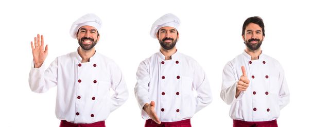 Chef saluting over white background - Photo, image