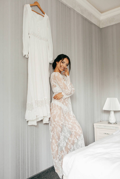 Young brunette woman boudoir in bride room - Foto, imagen