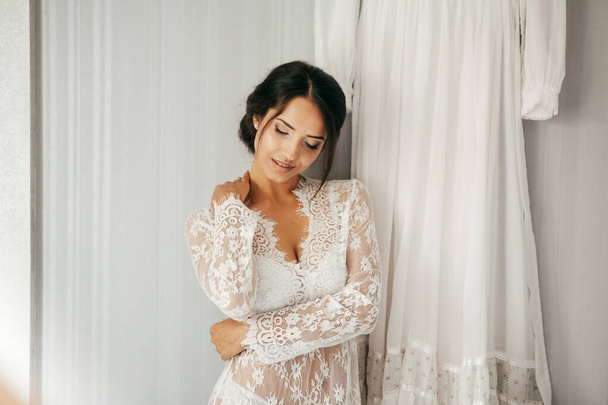 Young brunette woman boudoir in bride room - Фото, изображение