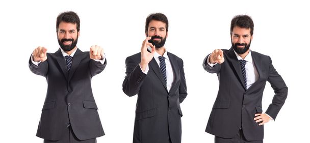 Businessman making Ok sign over white background - Photo, Image