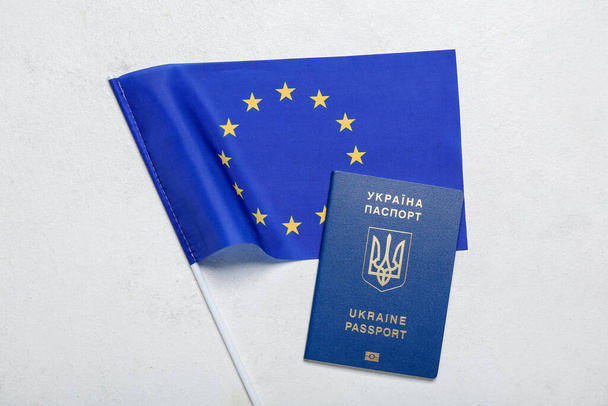 Ukrainian passport with flag of European Union on white background - Photo, Image
