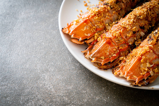 Stir Fried Mantis Shrimp with Garlic on white plate - Valokuva, kuva