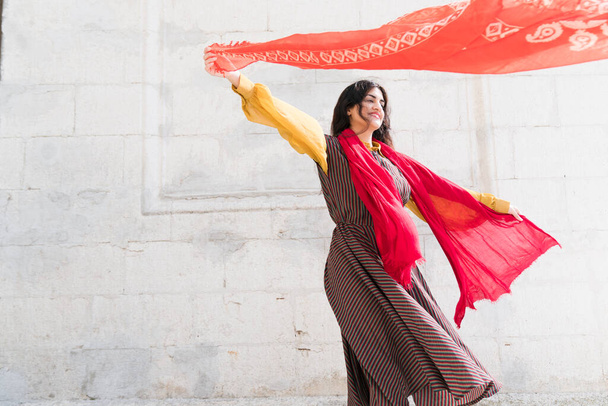 middle eastern woman with shawls in a mystical dance - Foto, imagen