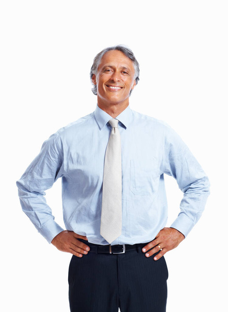 Elegant mature business man. Portrait of elegant mature business man smiling with hands on waist over white background - Fotoğraf, Görsel