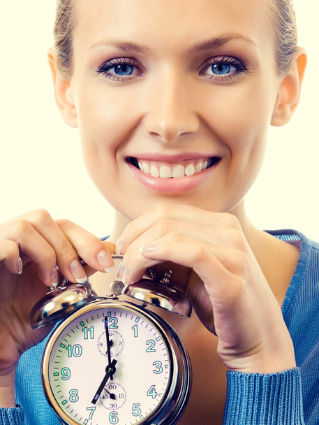 Portrait of young smiling woman with alarmclock - Foto, Imagem