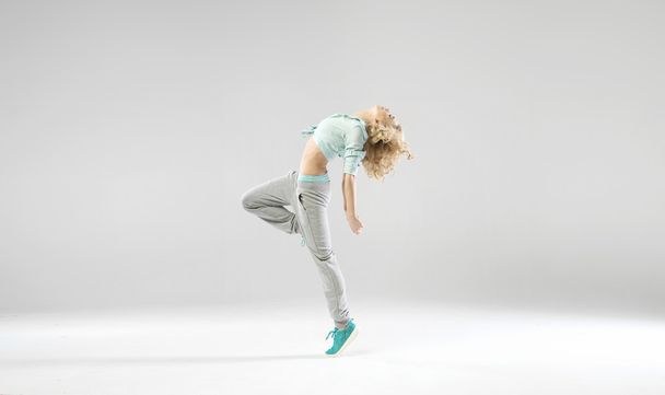 Portrait of exercising young lady - Фото, изображение