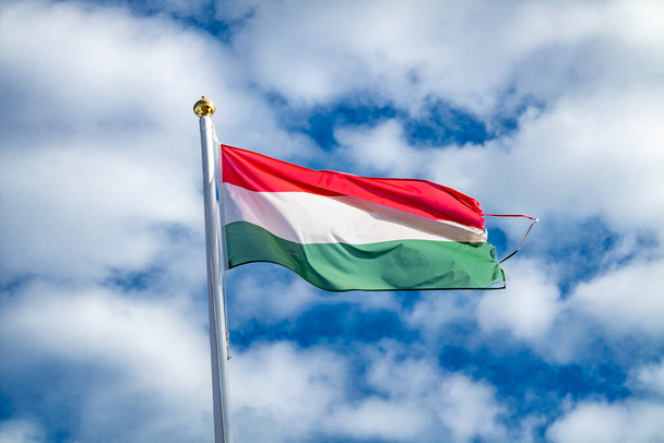 Hungarian flag or flag of Hungary waving in the wind. - Fotó, kép