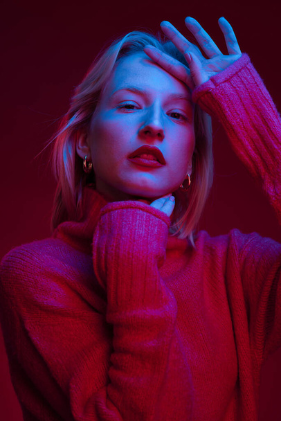 Beauty portrait of a woman with natural skin posing isolated on magenta background with photo gels. Viva magenta, color of the year. - Valokuva, kuva