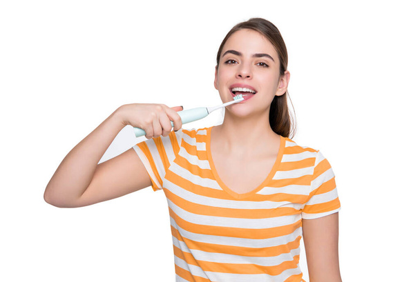 glad young girl with toothbrush isolated on white background. - Zdjęcie, obraz