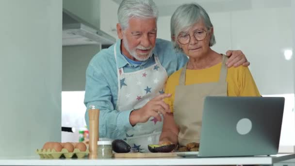 footage of beautiful senior couple cooking together at kitchen - Footage, Video