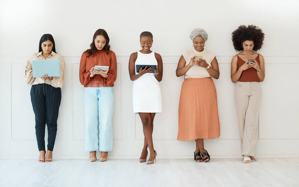 Business women, networking and communication in waiting room for social media, career opportunity or job search. Group of woman employees on multimedia devices for mobile app or network in a row. - Foto, Imagem