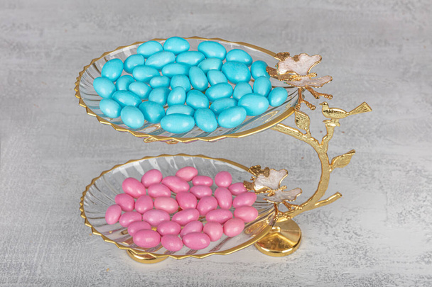 Colorful almond candies in the stylish, crystal candy bowl, almond sweets. The Sugar Feast concept. (Turkish name; Ramadan - Ramazan bayrami, Seker bayrami). - Photo, Image