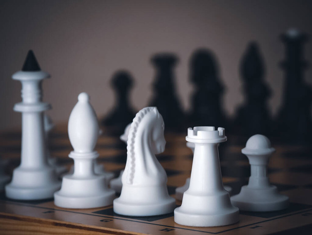 Chess game. Chess pieces on the game board. White and black. Tactical competition. Concept of a successful team work leader. Business strategy. - Photo, Image