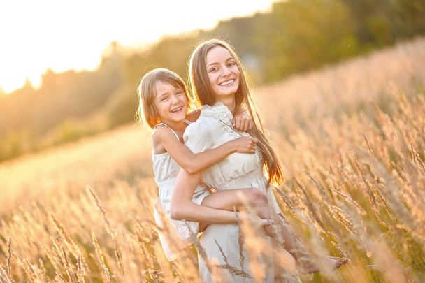 portrait of mother and daughter in nature - Фото, изображение