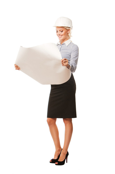 businesswoman architect looking on blueprints isolated on white background - Photo, Image