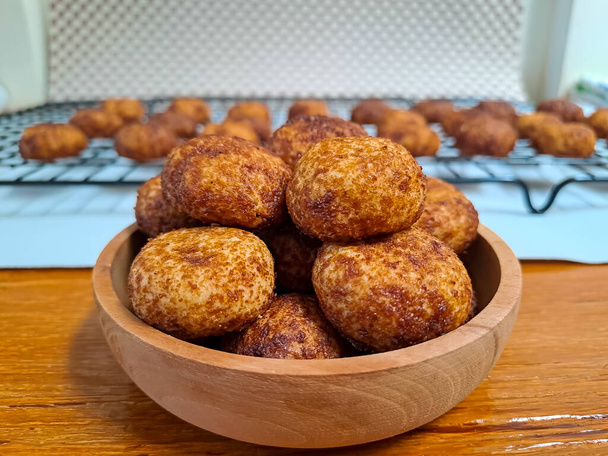 Cheese palm ball cookies, made from flour and cheese, then coated with sweet crunchy palm sugar. Popular serving to celebrate Eid Al Fitr (Lebaran Idul Fitri). Selected focus - Photo, Image
