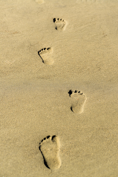Fußabdruck an einem Sandstrand - Foto, Bild