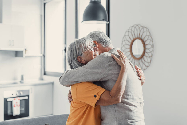 Happy mature couple in love embracing, laughing grey haired husband and wife with closed eyes, horizontal banner, middle aged smiling family enjoying tender moment, happy marriage, sincere feelings - Foto, Imagen
