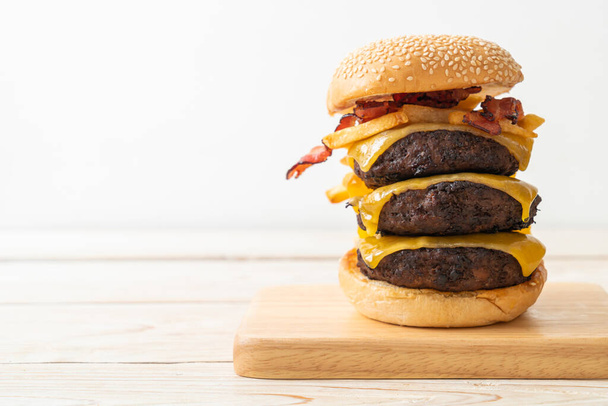 hamburger or beef burgers with cheese, bacon and french fries - unhealthy food style - Foto, Imagem